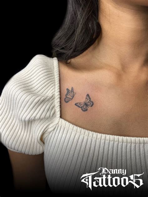 collar bone small butterfly tattoo on chest|49 eye